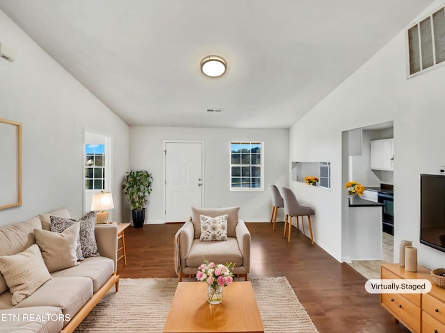 living room with dark hardwood / wood-style flooring