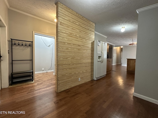 hall featuring a textured ceiling, dark hardwood / wood-style floors, and crown molding