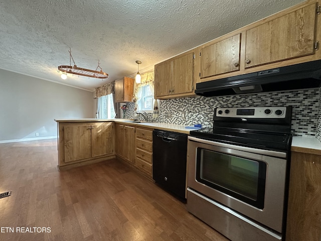 kitchen with pendant lighting, wood-type flooring, black dishwasher, sink, and stainless steel electric range oven