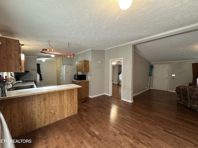 kitchen featuring white fridge with ice dispenser, backsplash, kitchen peninsula, and dark hardwood / wood-style flooring