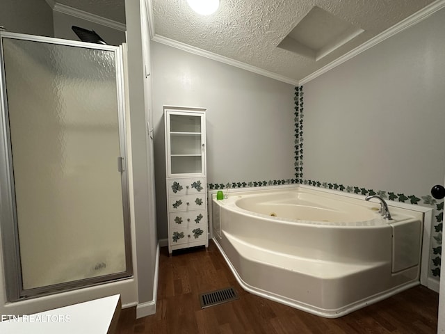 bathroom featuring hardwood / wood-style flooring, crown molding, a textured ceiling, and plus walk in shower