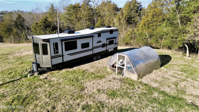 exterior space with a yard and an outdoor structure