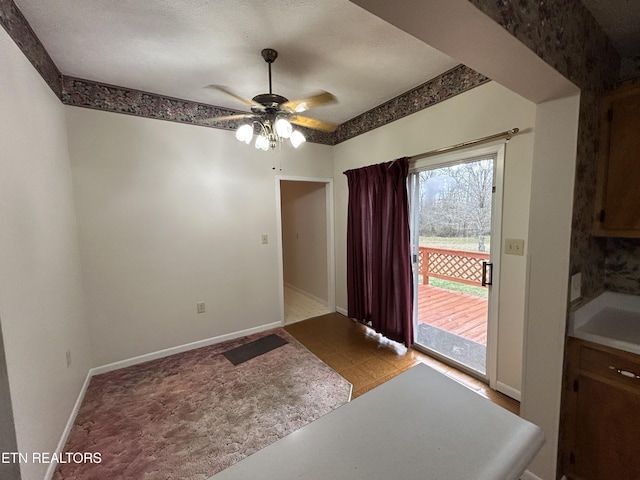 interior space featuring ceiling fan