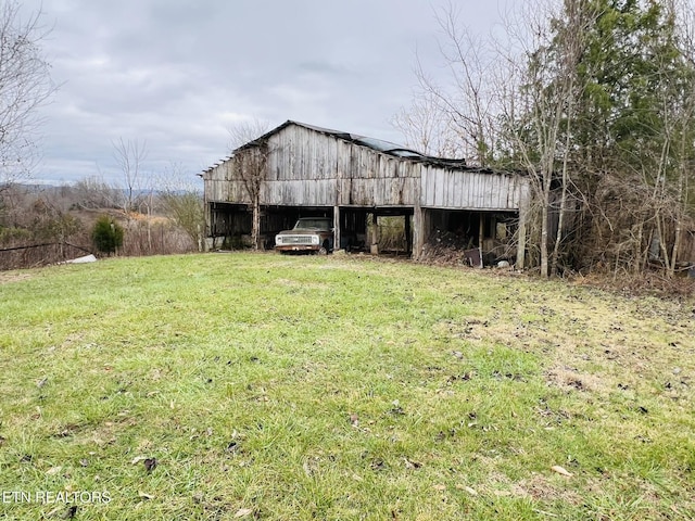 view of outdoor structure featuring a lawn