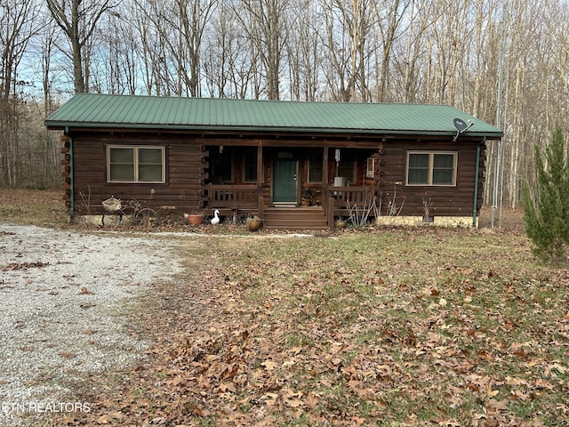 log-style house featuring a porch