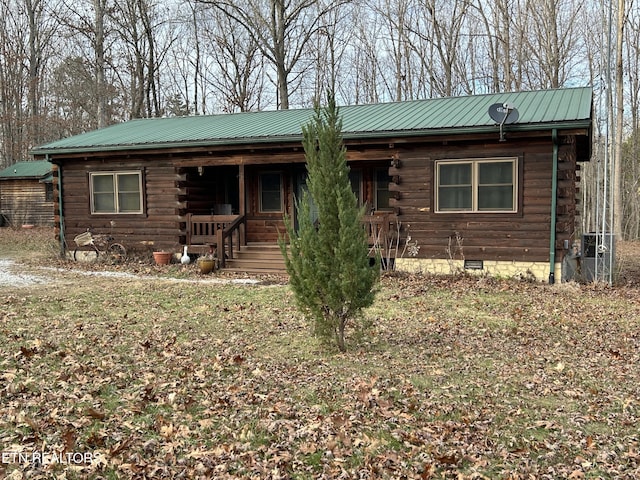 log-style house featuring a porch