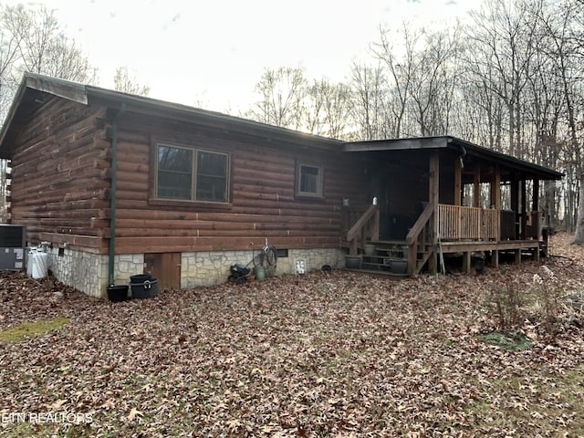 back of property featuring central air condition unit