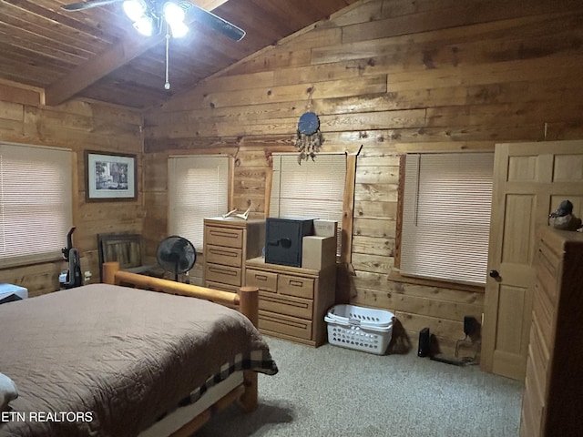 carpeted bedroom featuring vaulted ceiling with beams, wooden ceiling, ceiling fan, and wooden walls