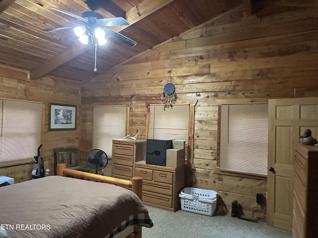 bedroom with vaulted ceiling with beams, wood ceiling, ceiling fan, and wood walls