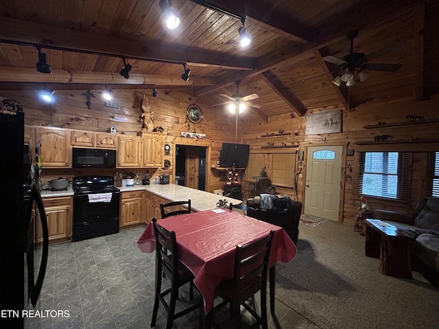 dining space with ceiling fan, wood walls, wood ceiling, and lofted ceiling with beams