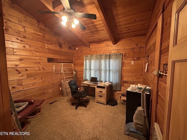 unfurnished office featuring carpet flooring, ceiling fan, wooden ceiling, vaulted ceiling with beams, and wood walls