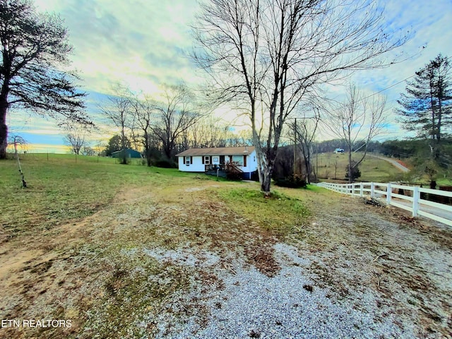 view of yard with a rural view