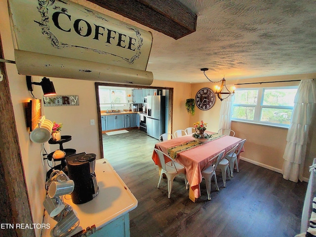 1471 Harold Patterson Rd, Dandridge, TN 37725 - dining area featuring dark wood finished floors and a chandelier