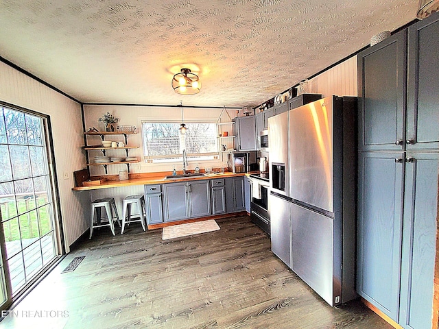 1471 Harold Patterson Rd, Dandridge, TN 37725 - kitchen with wooden counters, open shelves, appliances with stainless steel finishes, a textured ceiling, and dark wood finished floors