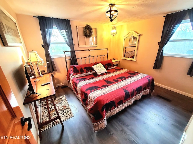 bedroom featuring dark wood-type flooring