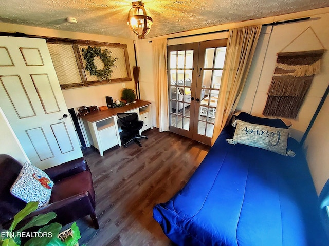 1471 Harold Patterson Rd, Dandridge, TN 37725 - bedroom with french doors, dark wood-style floors, and a textured ceiling