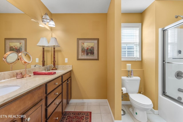 full bathroom featuring toilet, tile patterned floors, bath / shower combo with glass door, and vanity