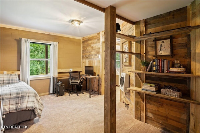 bedroom featuring heating unit and light colored carpet