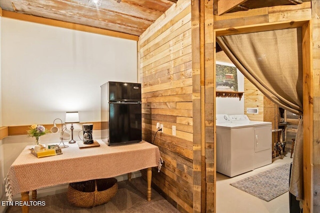 bathroom with wood walls, washer and clothes dryer, and wooden ceiling