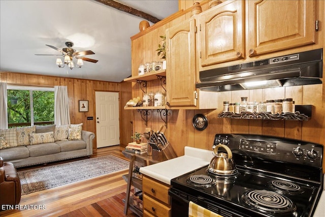 kitchen featuring electric range, ceiling fan, wood walls, lofted ceiling, and light wood-type flooring