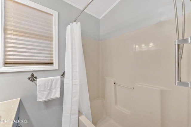 bathroom featuring vanity, shower / bath combination with curtain, and ornamental molding