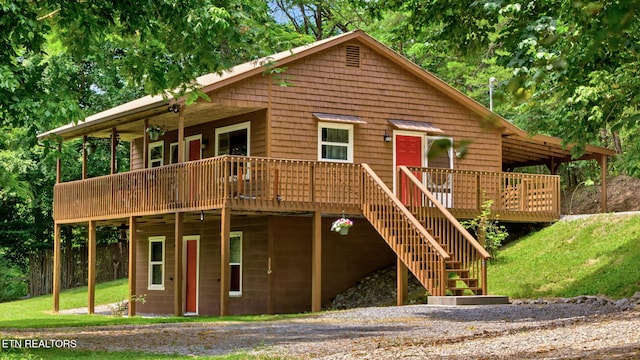 view of front of home with a front lawn and a deck