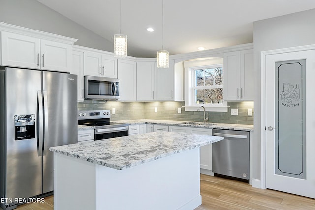 kitchen with white cabinets, stainless steel appliances, and sink