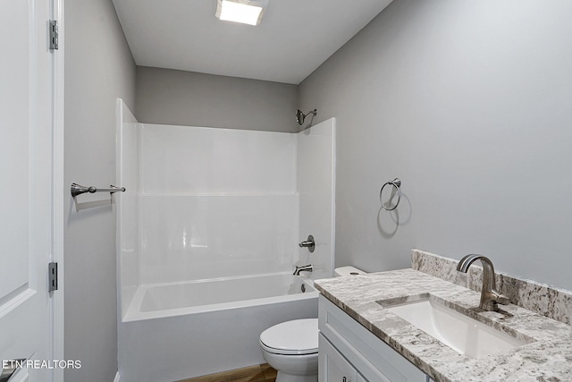 full bathroom with vanity, toilet, and washtub / shower combination