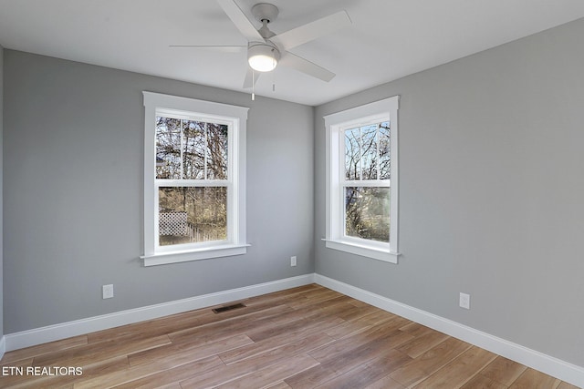 unfurnished room featuring light wood-type flooring and ceiling fan