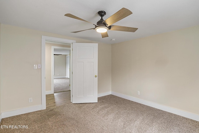 spare room featuring carpet flooring and ceiling fan