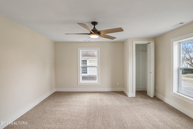 unfurnished bedroom featuring carpet and ceiling fan