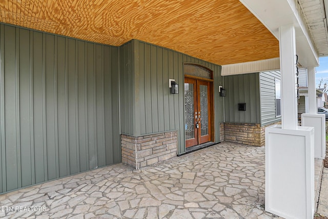 view of exterior entry featuring french doors