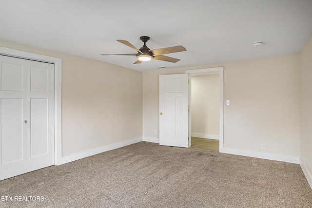 unfurnished bedroom featuring ceiling fan, carpet floors, and a closet