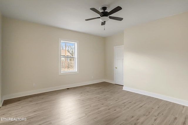 unfurnished room with light hardwood / wood-style flooring and ceiling fan