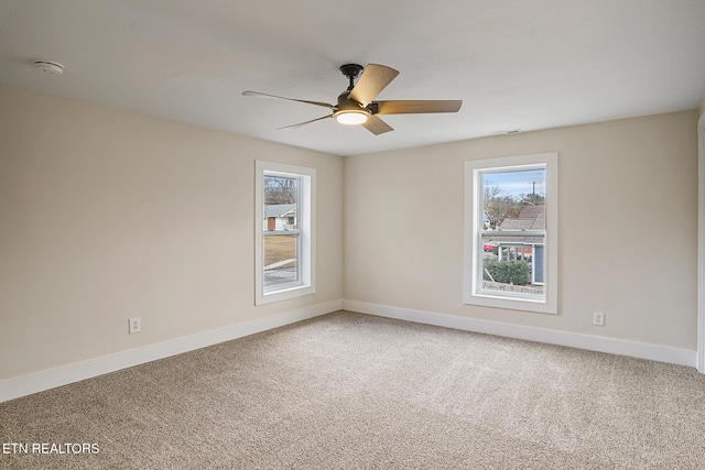 unfurnished room featuring carpet and ceiling fan