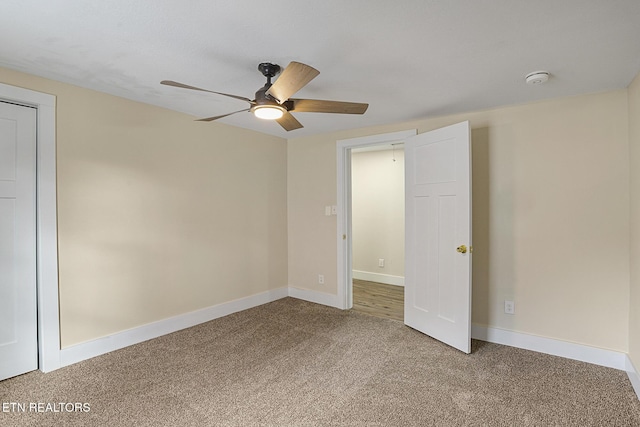 unfurnished bedroom with ceiling fan and carpet floors