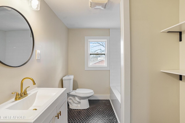 bathroom featuring tile patterned flooring, vanity, and toilet