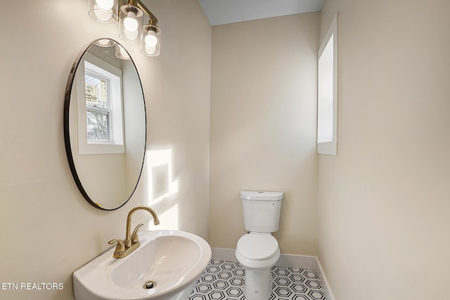 bathroom featuring tile patterned floors, sink, and toilet