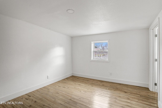 empty room with light wood-type flooring