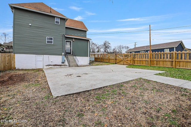 back of property featuring a patio