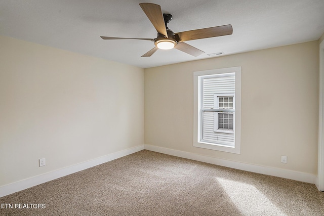 unfurnished room featuring carpet and ceiling fan