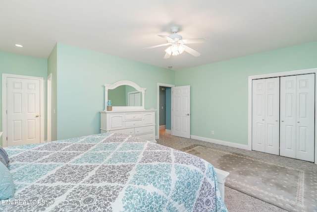 bedroom featuring ceiling fan, a closet, and light carpet