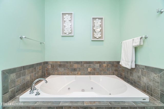 bathroom with tiled tub