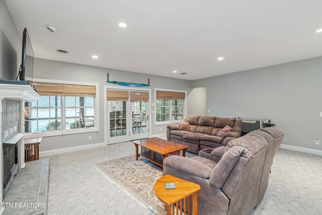 carpeted living room with a fireplace