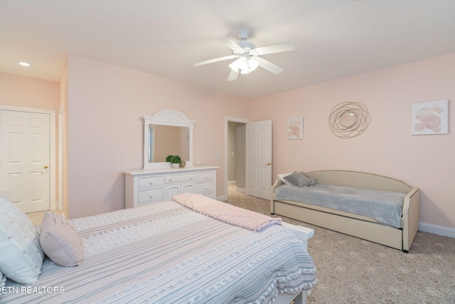 bedroom with ceiling fan and light colored carpet