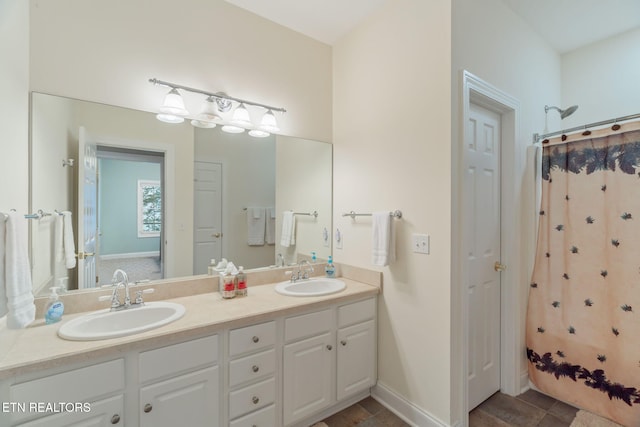 bathroom with vanity and curtained shower