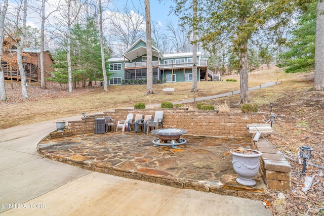 view of yard featuring a patio area and a wooden deck