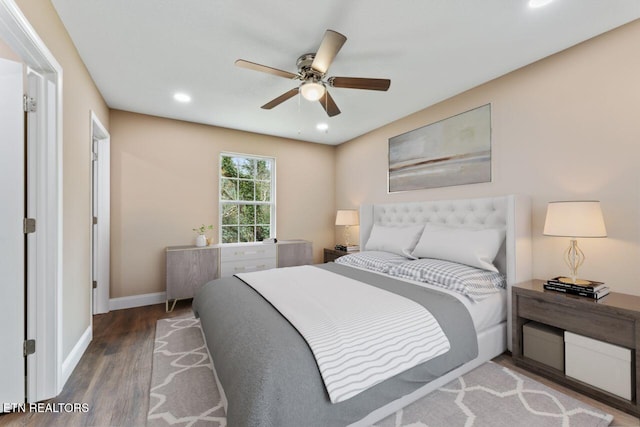 bedroom with wood finished floors, ceiling fan, baseboards, and recessed lighting