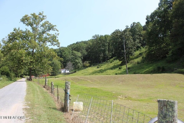 exterior space with a rural view and a lawn