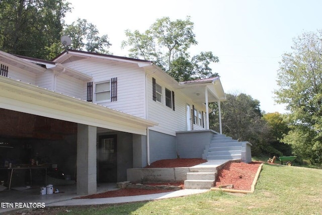 view of home's exterior featuring a lawn